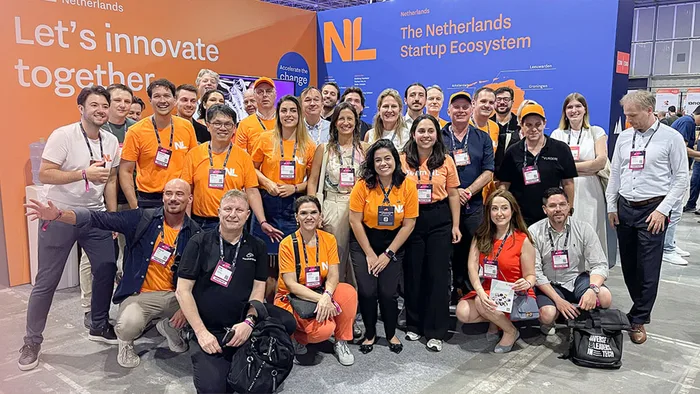 Netherlands startup ecosystem team at CES in orange Team NL shirts